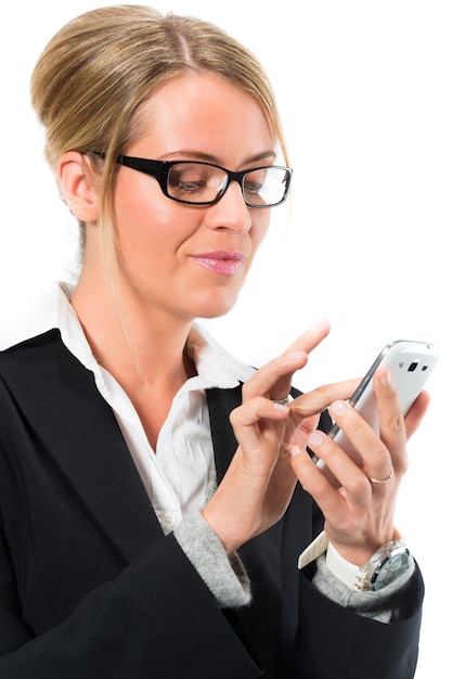 Young woman using her mobile phone for texting