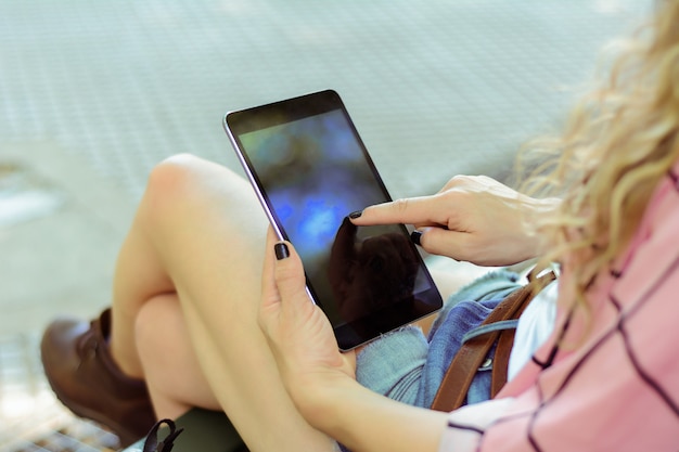 Young woman using her tablet.