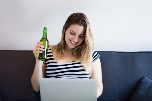 Young woman using a laptop computer at home