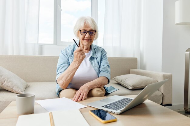 Young woman using laptop at home