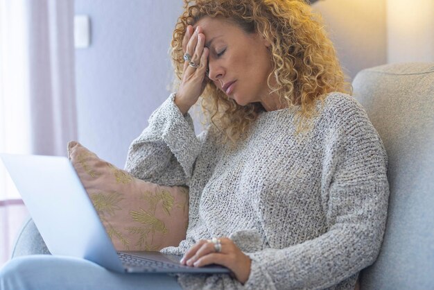 Young woman using laptop at home