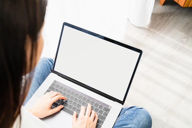 Young woman using a laptop at home