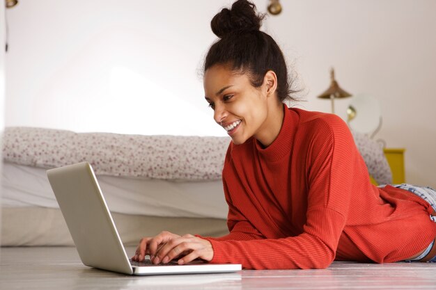 Young woman using laptop at home