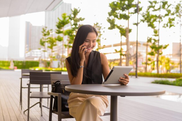 Young woman using laptop at table