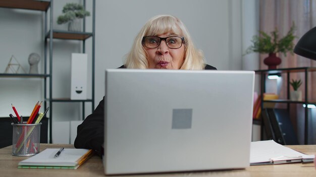 Young woman using laptop at table