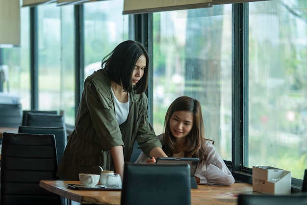 young woman using laptop at table