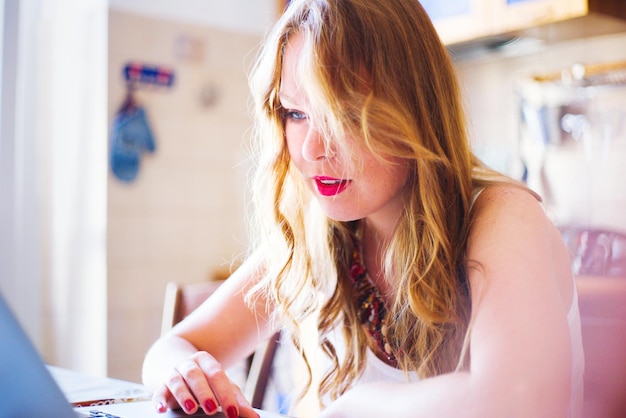 young woman using laptop