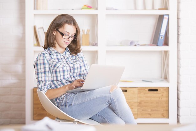 Young woman using laptop