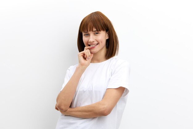 young woman using mobile phone against white background