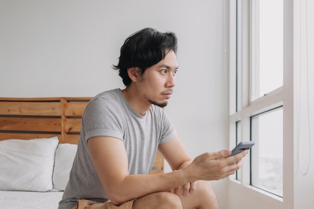 Young woman using mobile phone at home