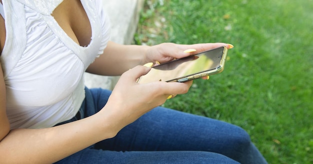 Young woman using mobile phone in outdoors