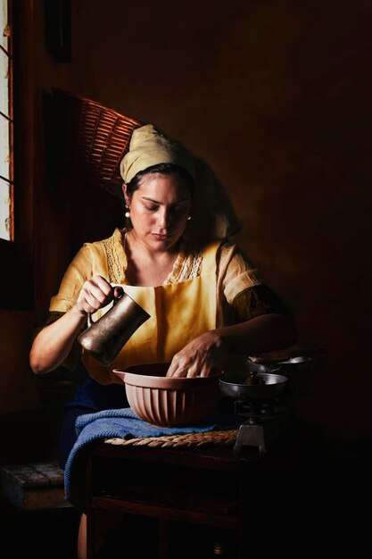 Photo young woman using mobile phone while sitting on table