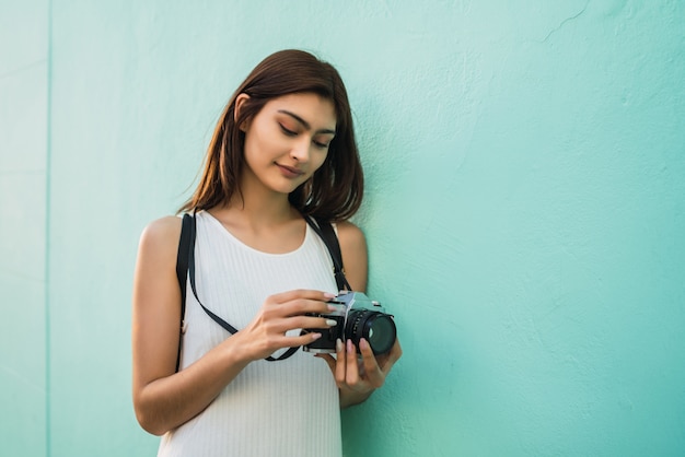 Young woman using a professional camera