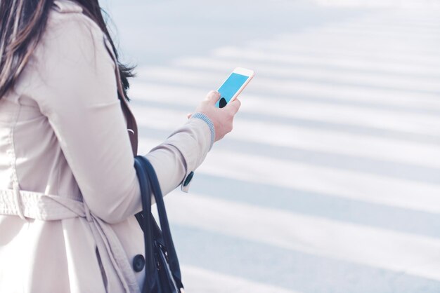 Young woman using smart phone