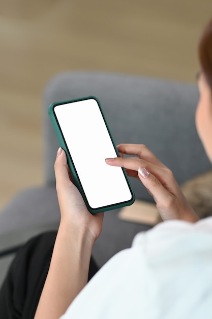 Young woman using a smartphone at home