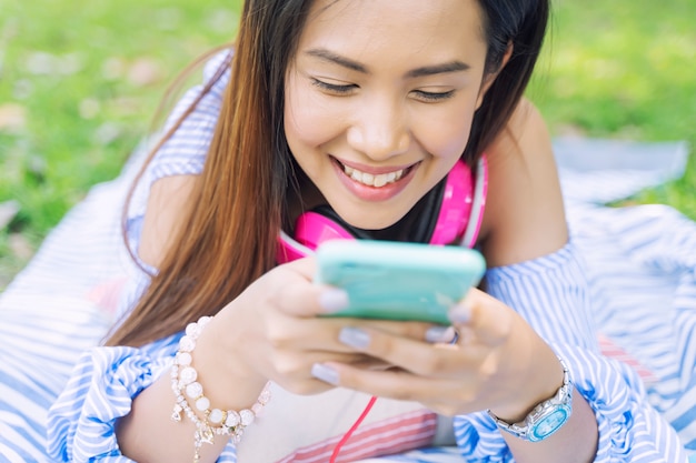 Young woman using smartphone for working