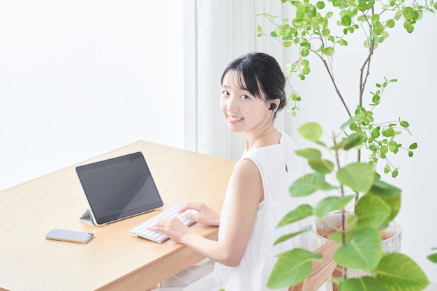 Young woman using tablet PC