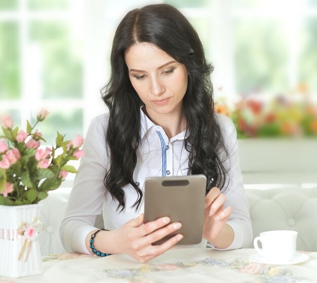 Young woman using tablet