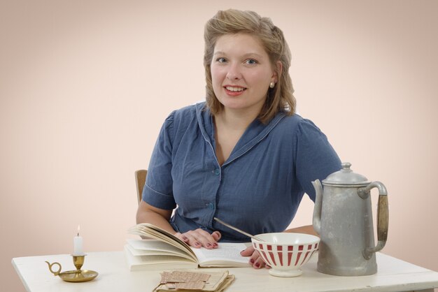 Young woman in vintage costume read a book