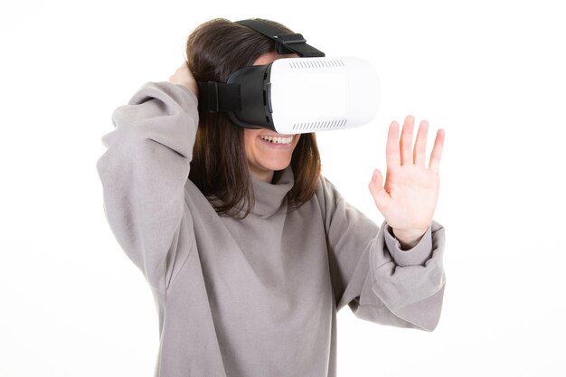 Young woman in virtual reality vr glasses in concept of modern technologies on white background