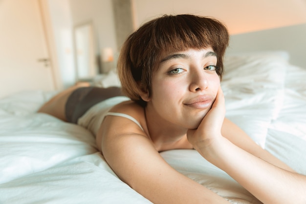 Young woman waking-up at home