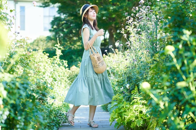 Young woman walking in green