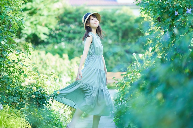 Young woman walking in green