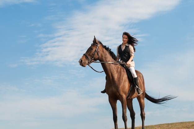 Young woman walking with a horse