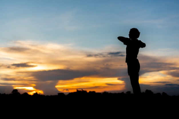 Young woman warming up outdoors at park