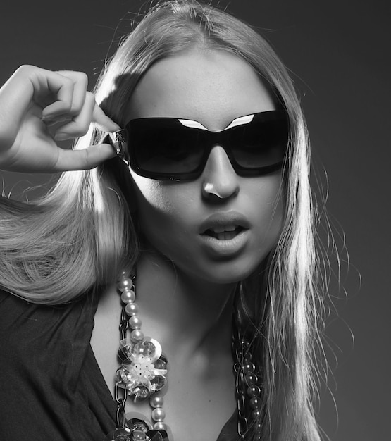 Young woman wearing the big modern sunglasses