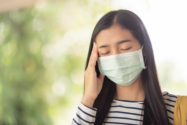 Young woman wearing mask