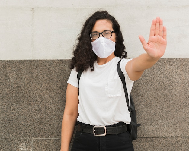 Young woman wearing a medical mask outdoors