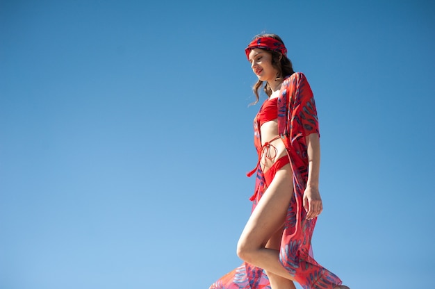 Young woman wearing red beach wear