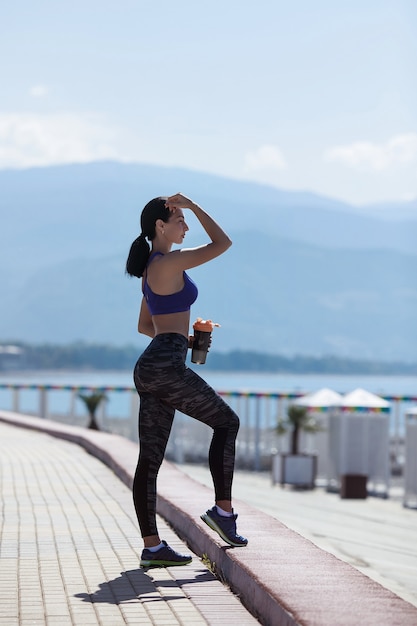 Young woman wearing sportswear exercising