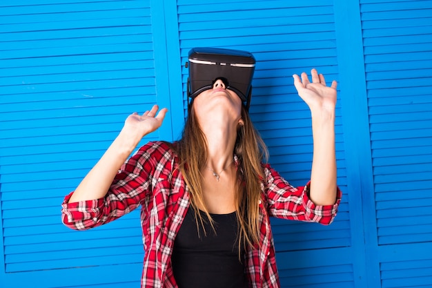 Young Woman Wearing Virtual Reality Headset In Studio