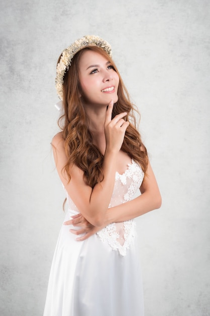 Young woman wearing white dress