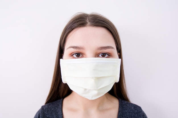Young woman wears a face mask.