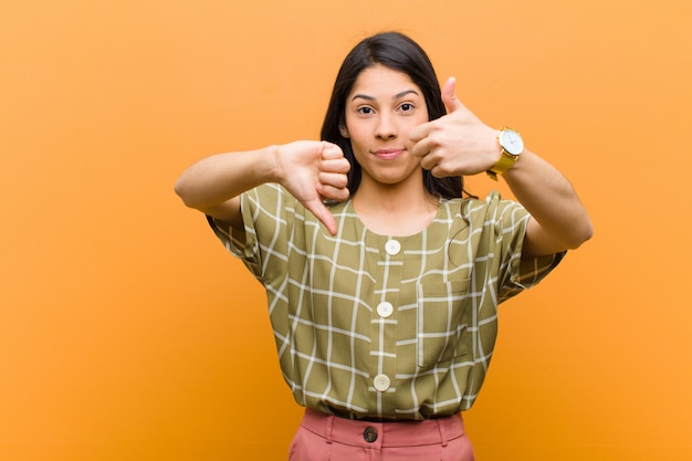 Young woman weighing the good and bad in different options