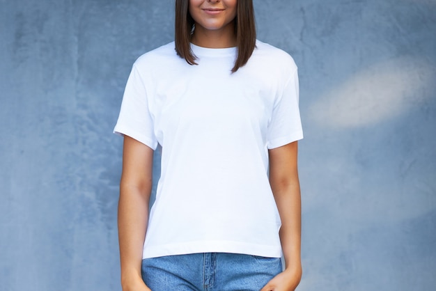 Young woman in white shirt. High quality photo