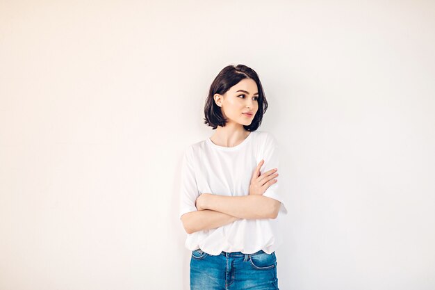 Young woman in a white shirt and jeans