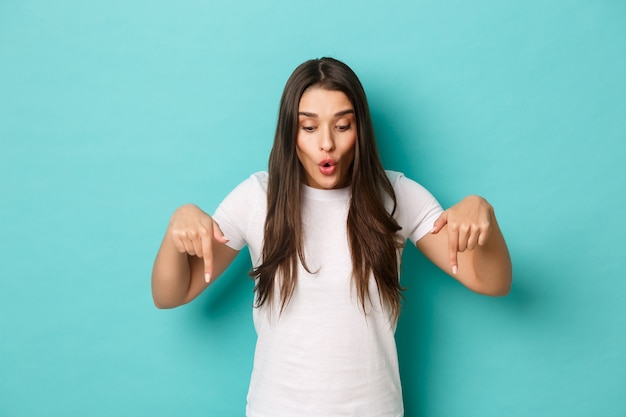 Young woman in white T-shirt posing