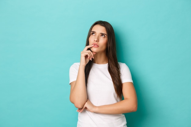 Young woman in white T-shirt posing