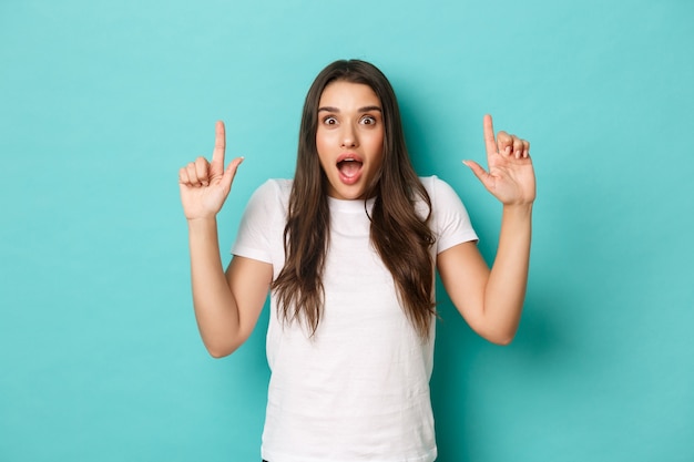 Young woman in white T-shirt posing