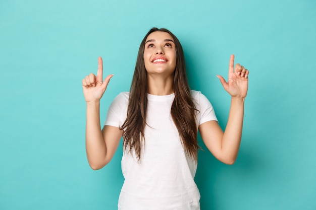 Young woman in white T-shirt posing