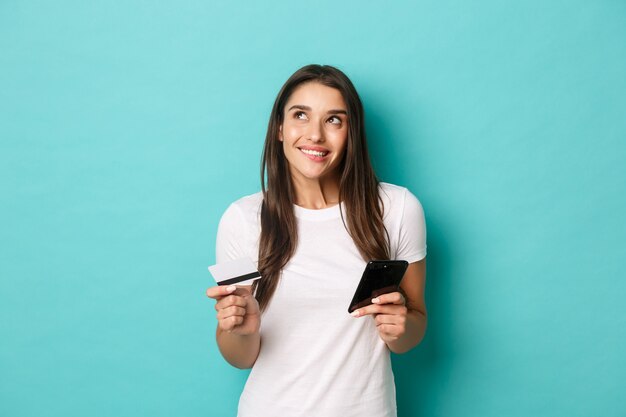 Young woman in white T-shirt posing