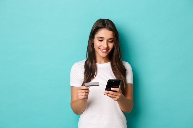 Young woman in white T-shirt posing