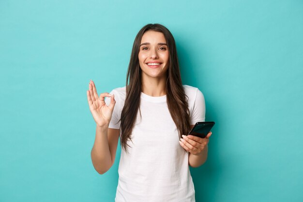 Young woman in white T-shirt posing