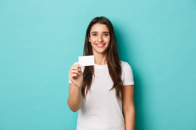 Young woman in white T-shirt posing