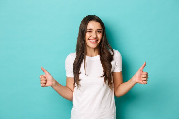 Young woman in white T-shirt posing