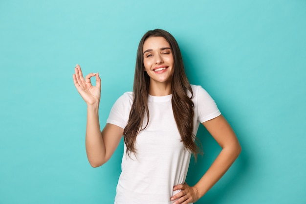 Young woman in white T-shirt posing